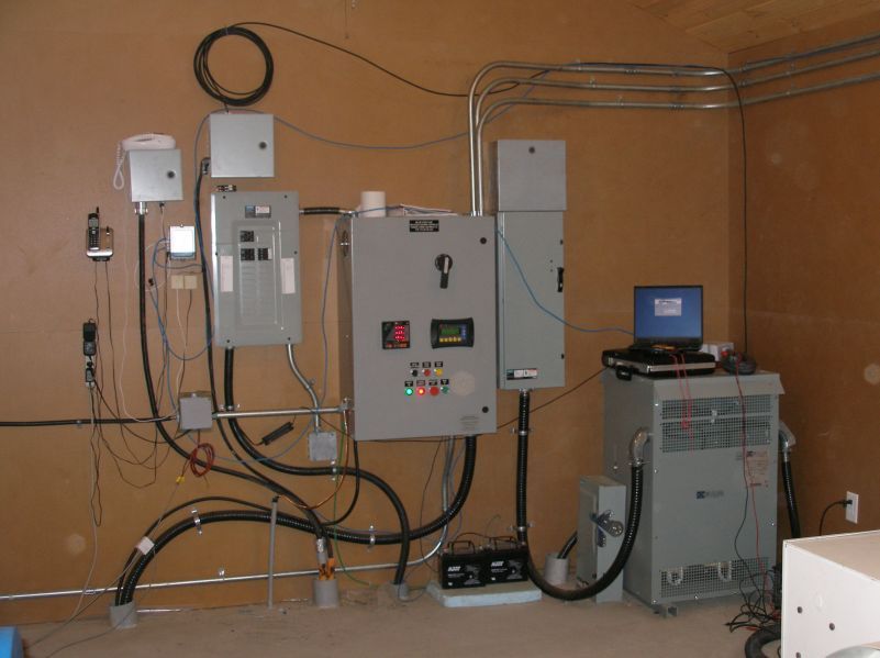 From right to left, 75 kVA  240 to 600 volt transformer, main disconnect, governor control panel, distribution breakers, fiber optic terminus, head level control.